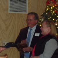 <p>First Selectman Jayme Stevenson honors Al Tibbetts and Laurie Griffith.</p>