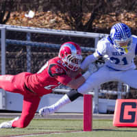 <p>Darien&#x27;s Nick Lombardo pulls in a pass near the goal line against New Canaan during their game on Thanksgiving. The teams meet again on Saturday in Stamford for the Class L championship.</p>