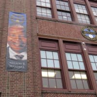 <p>Nelson Mandela hangs high in the streets of Mount Vernon.</p>