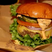 <p>The &quot;Habanero Express&quot; comes with pepperjack, iceberg lettuce, tomatoes, poblano pepper relish, raw red onions, spicy pickle chips and habanero chipotle mayo ($10.45, recommended with elk). 
</p>