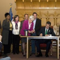 <p>Gov. Dannel Malloy signs into law a comprehensive legislative package on gun violence, mental health and school safety reforms. He is joined by family members of victims, anti-violence advocates and state officials. </p>