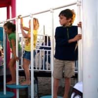 <p>Children get their first chance to play at Fairfield&#x27;s playground in September in honor of Sandy Hook victim Jessica Rekos. Photo </p>