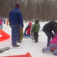 <p>Kids and adults enjoy sledding in Darien&#x27;s Baker Park Saturday afternoon.</p>
