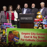<p>Empire City Casino presented toys and coats to Catholic Charities at the end of its holiday drive.</p>