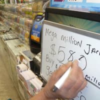 <p>The Mega Million jackpot was up to $586 million by 3 p.m. Monday at Photo Pro in White Plains.</p>