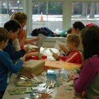 <p>Students of all ages helped decorate the packages on Dec. 11.</p>