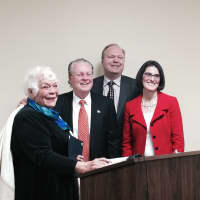 <p>The Fairfield Board of Selectmen presents Jeanne Harrison with a gift and a certificate from U.S. Rep. Jim Himes for her work in the town of Fairifield.</p>