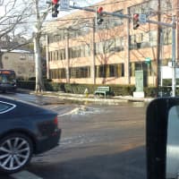 <p>Water from a burst main floods the intersection of Arch Street and Railroad Avenue in Greenwich on Thursday.</p>