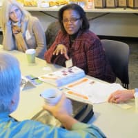 <p>Judy Douglas of The Volunteer Center of United Way speaks about services to Margaret Tijmos Goldberg of the Greenburg Nature Center and Paul Anderson-Winchell of Grace Church Community Center.</p>