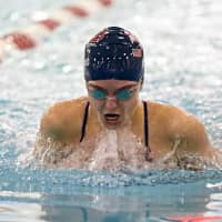 <p>Brooke Collins swims to one of her five victories in the 15-and-over division.</p>
