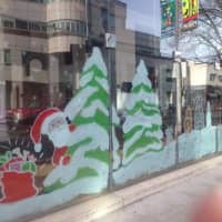 <p>The windows at the Stamford Media Center are painted for the Christmas season. </p>