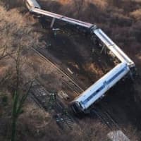 <p>A Metro-North passenger train derailed in the Bronx near the Spuyten Duyvil station in December. Four were killed, including Kisook Ahn who worked in Ossining and Montrose resident James Ferrari.</p>