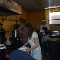 <p>Volunteers prepare dinner at the 20th annual Westchester Community Christmas Day Dinner at St. Mary&#x27;s School in Katonah.</p>