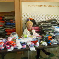 <p>Elaine Tabakman mans the women&#x27;s clothing room at the 20th annual Westchester Community Christmas Day Dinner</p>