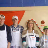 <p>The Kingston family of Cross River serves dinner at the 20th annual Westchester Community Christmas Day Dinner</p>