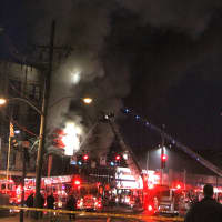 <p>Police and firefighters battling the blaze on South Broadway.</p>