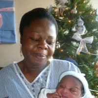 <p>Respy Okang and her newborn son Andrew.</p>