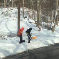<p>A snow day is not a day off for these Westport kids who are out shoveling early. </p>
