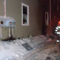 <p>Firefighters outside the South Main Street home. </p>