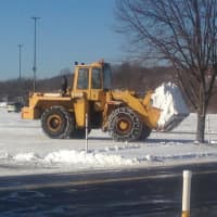 <p>A payloader clears snow from the parking lot at the Danbury Fair Mall. 
</p>