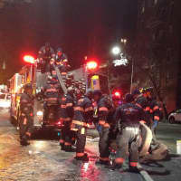 <p>Yonkers firefighters struggled to get hoses hooked up in icy conditions. </p>