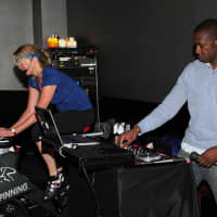 <p>DJ Catch helps lead a class at The GYM that raised money for The Make-A-Wish Foundation.</p>