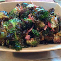 <p>The brussels sprouts are roasted with bacon, cider and maple gastrique, or caramelized sugar, deglazed with vinegar.</p>