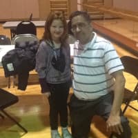 <p>First-grader Remi Aaron and chess expert Felix Lopez at children&#x27;s chess tournament at Saw Mill Club.</p>