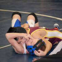 <p>Nicky Singer of the Norwalk Mad Bulls pins his opponent.</p>