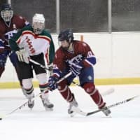 <p>Harvey&#x27;s Keith Lambert of Cortlandt Manor and Rye Country&#x27;s Curtis Rattner (12) of Waccabuc work to control the puck.</p>