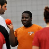 <p>A Blackham student holds the shot put during the clinic at Sacred Heart University.</p>