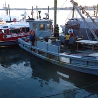 <p>Norwalk firefighters arrive at the blaze aboard the department&#x27;s fireboat. </p>