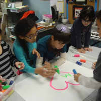 <p>Westchester Day School students create a mural to be donated to the Spring Brook Manor Nursing Home in Scarsdale.</p>