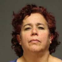 <p>Lourdes Rodriguez-Deets, 52, of Norwalk, was charged by Fairfield police with sixth-degree larceny and sixth-degree conspiracy to commit larceny.</p>