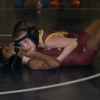 <p>Jacob Gonzales pins an opponent from Bethel.</p>