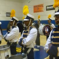 <p>The Marching Cobras drum section at attention.</p>