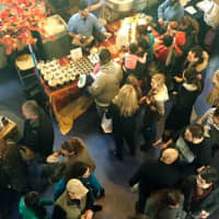 <p>The walkways at the Maritime Aquarium in Norwalk are packed with vendors and visitors looking to taste everything available at the Chocolate World Expo. </p>