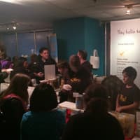 <p>The owners of Ola! Granola offer tastes of all their products at the Chocolate World Expo on Sunday afternoon. </p>