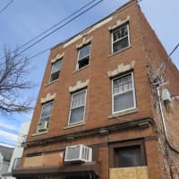 <p>Fire tore through all three stories of this New Rochelle building.</p>