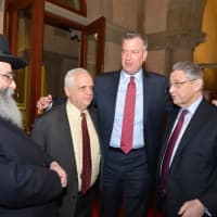<p>Mayor Bill de Blasio, at the entrance of the Chambers, with
Rabbi Niederman, Assemblyman Joe Lentol, and Speaker Sheldon Silver.</p>