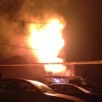 <p>Norwalk firefighters battle a blaze that spread to two stories of a Norwalk home early Friday morning.  </p>