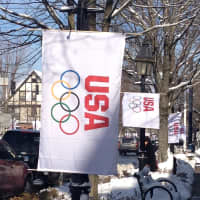 <p>A USA banner flies along a street in Ridgefield.</p>