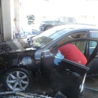 <p>Star Auto Spa workers clean the interior of a car being prepared for the car wash.</p>