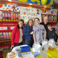 <p>Nancy Joselson and the Greenberg family at their hot cocoa stand in Scarsdale.</p>