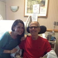 <p>Christina Yackery visits her father while he undergoes rehabilitation at the Westport Health Center.</p>