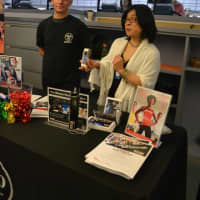 <p>Club Fit staff members host a table to distribute information and to answer questions.</p>