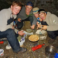 <p>Andrew Allison-Godfrey, right, of Westport and fellow hikers cook during their excursion in India.</p>
