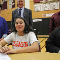 <p>Salma Anastasio signs a letter to continue her soccer career at Clemson.</p>