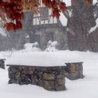 <p>Snow is starting to pile up on a stone wall during the nor&#x27;easter. </p>