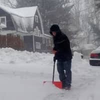 <p>A teenager heads out to shovel as the nor&#x27;easter rages in Danbury on Thursday. </p>